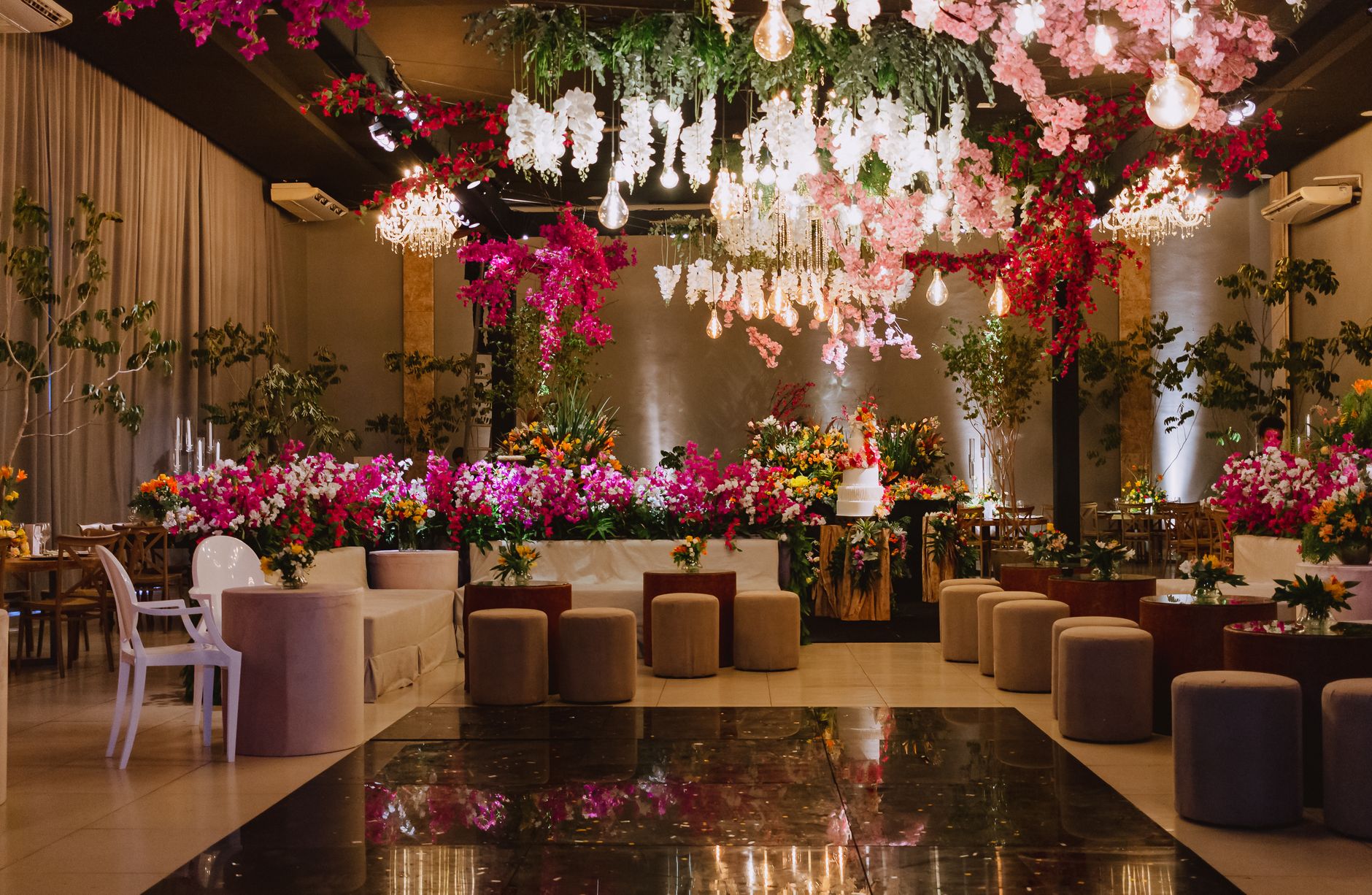 Elegant wedding venue with floral decorations and chandeliers. — Top 10 Questions You Must Ask Your Interior Designer Before